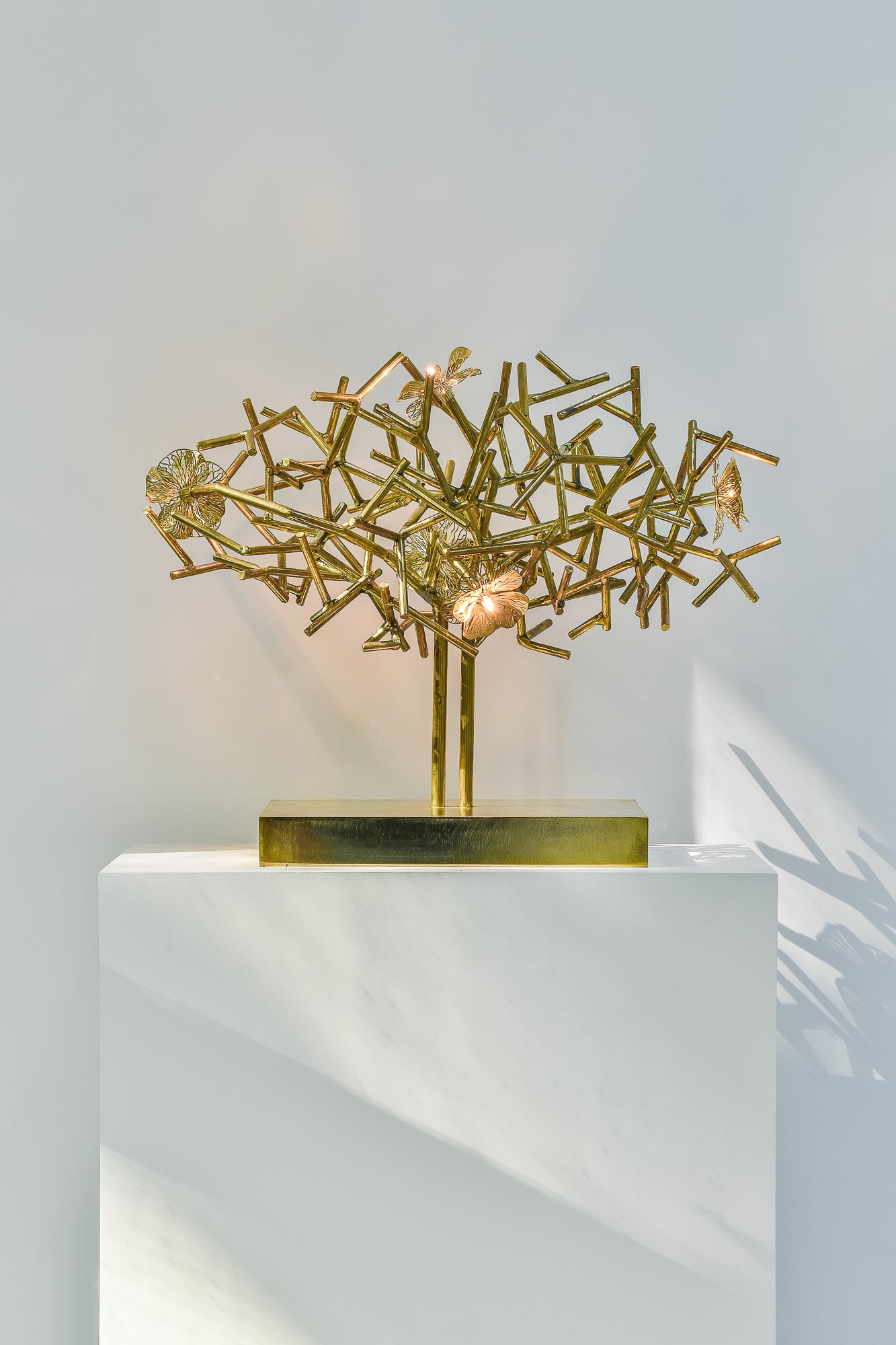 Indoor sculpture with lighting brass steel by annet van egmond